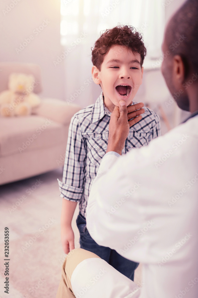 Smart professional male doctor doing his job
