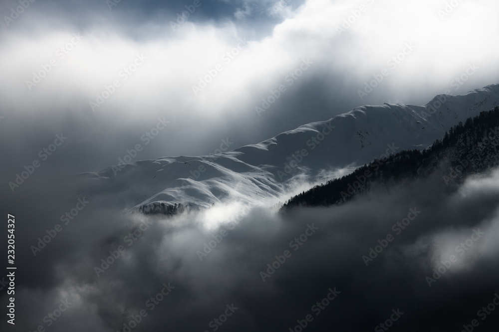 Clouds and light effects on the snow in the mountains Clouds and light effects on the snow in the mountains