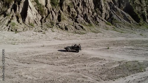 Aerial view of road in valley with a off road jeep in Tarlac, Philippines. photo