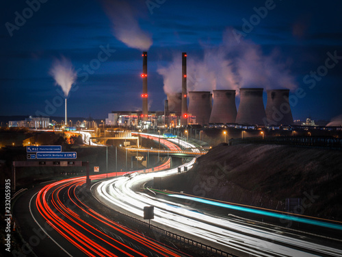 A Busy Motorway Scene In Front Of Ferrybridge Power Station