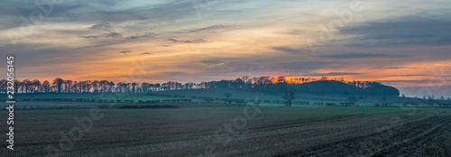 A Lomg Panoramic Photo Of A Sunset In The Countryside photo