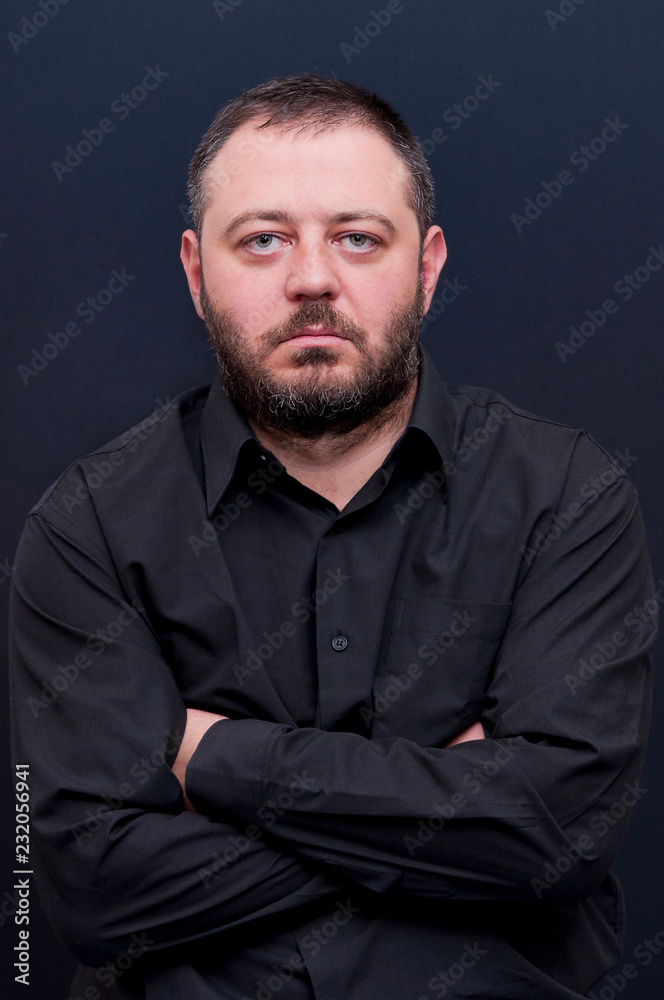 Portrait of serious man with black shirt