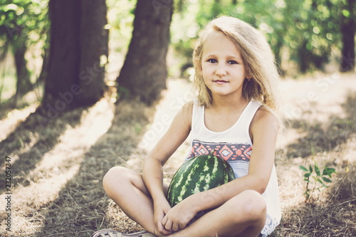 portrait of a girl in park with watermelon