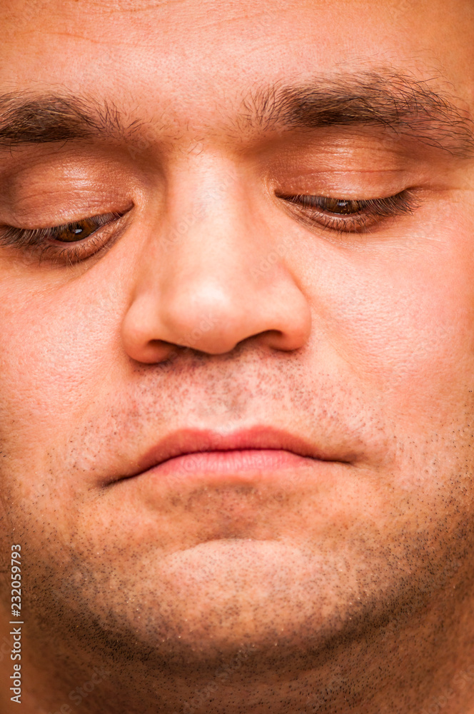 Looking down man. Facial expression, emoji face, emotion close-up. Looking down man. Facial expression, emoji face, emotion close-up.