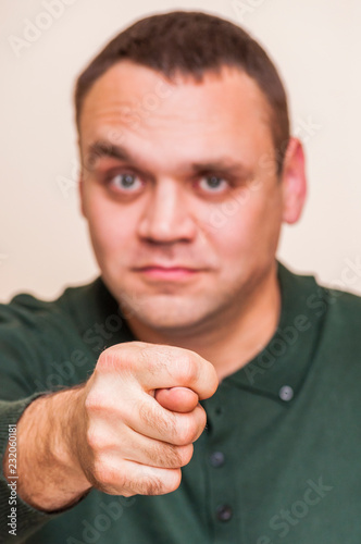 Man showing hand sign, obscene gesture, thumb