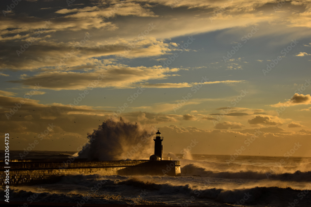 Waves breaking on the lighthouse