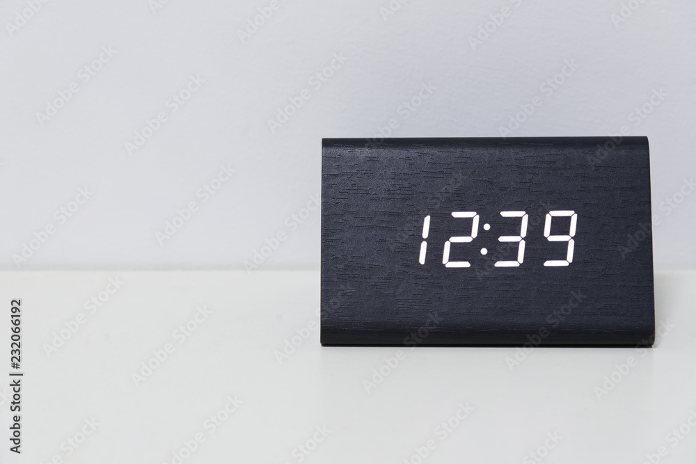 Black digital clock on a white background showing time 12:39