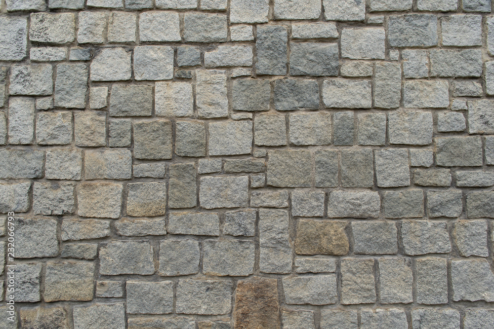 Texture of the granite stone wall for background