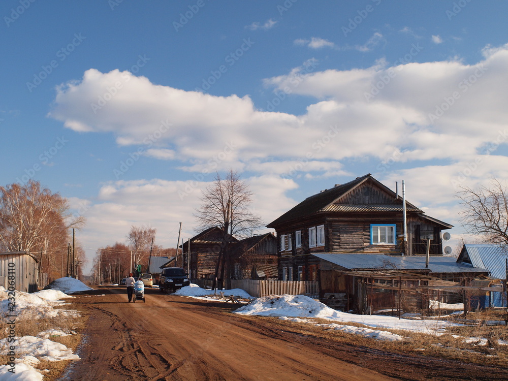 Spring street in a small Russian town. Russian spring nature. Russia, Ural, Perm Region