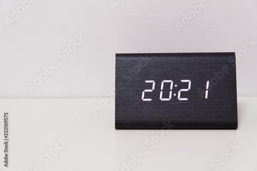 digital table clock showing 20:21 time