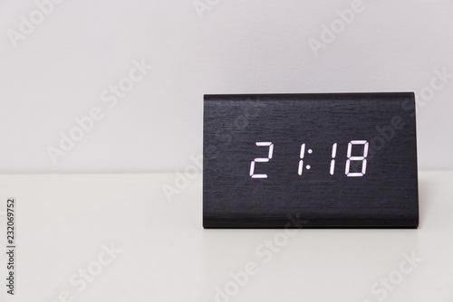 digital table clock showing 21:18 time