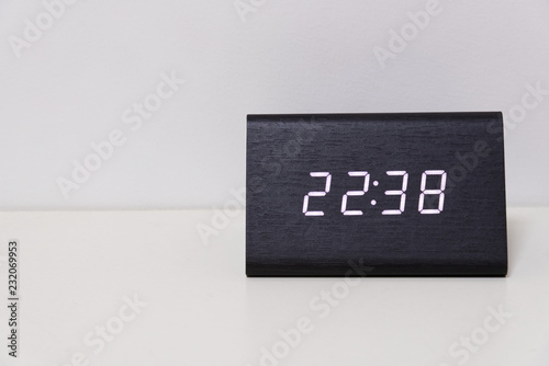 digital table clock showing 22:38 time