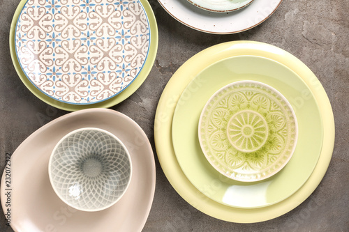 Set of clean color plates on table