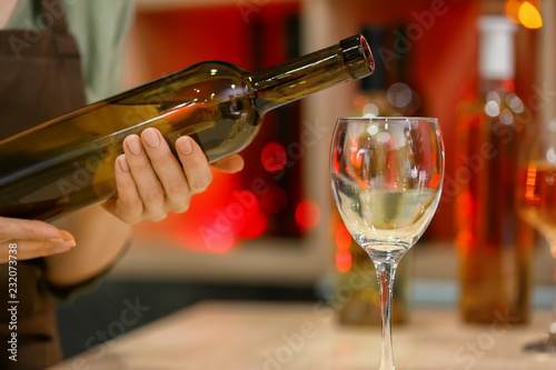 Hand Holding Wine Bottle Ov...