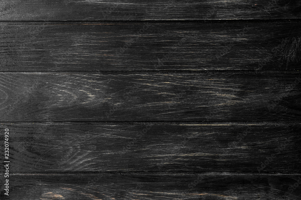 Naklejka premium Dark wooden texture as background