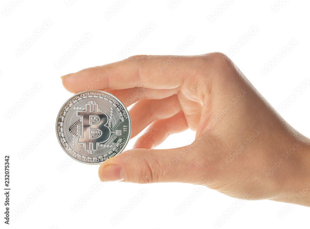 Female hand holding bitcoin on white background Female hand holding bitcoin on white background