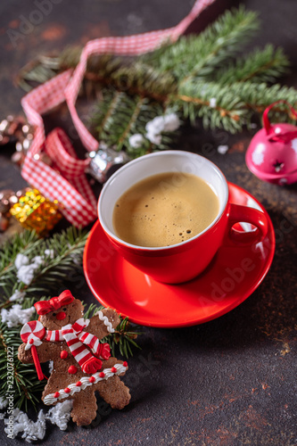 Coffee espresso  red cup of coffee and Christmas decorations on dark background.