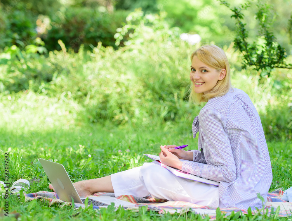 Stay free with remote job. Managing business remote outdoors. Woman with laptop sit grass meadow. Best jobs to work remotely. Business lady freelance work outdoors. Remote job concept Stay free with remote job. Managing business remote outdoors. Woman with laptop sit grass meadow. Best jobs to work remotely. Business lady freelance work outdoors. Remote job concept