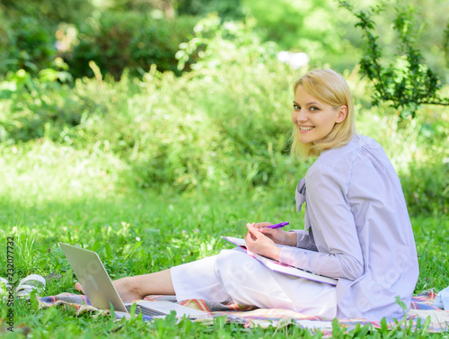 Stay free with remote job. Managing business remote outdoors. Woman with laptop sit grass meadow. Best jobs to work remotely. Business lady freelance work outdoors. Remote job concept © be free