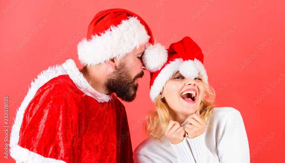Man with beard and woman santa hat red background. Christmas masquerade karnival concept. Couple cheerful face celebrate christmas. Rent santa costume. Couple celebrate winter holiday christmas party Man with beard and woman santa hat red background. Christmas masquerade karnival concept. Couple cheerful face celebrate christmas. Rent santa costume. Couple celebrate winter holiday christmas party
