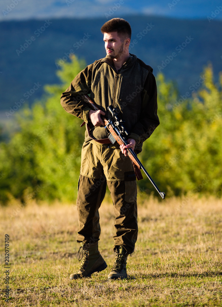 Hunter with rifle looking for animal. Hunting shooting trophy. Mental  preparation for hunting individual process. Man rifle for hunt. Hunter  khaki clothes ready to hunt hold gun mountains background Stock Photo |