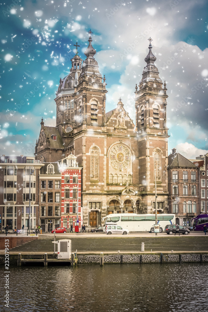 Church of St Nicholas over canal with snow, Amsterdam, Holland