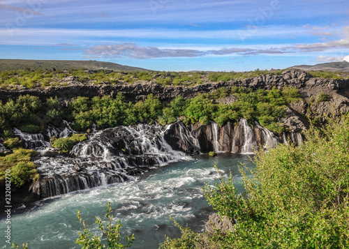 Lava falls Hraunfossar run as tiny waterfalls and rapids into the Hvita River, Borgarfjordur, West Iceland, Europe