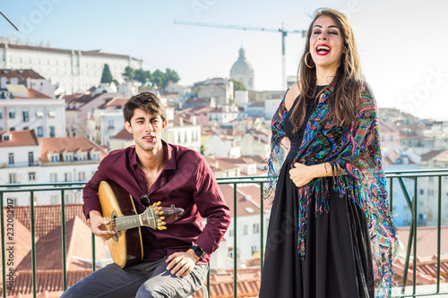 Beautiful fado singer performing with handsome portuguese guitarist player, Portugal