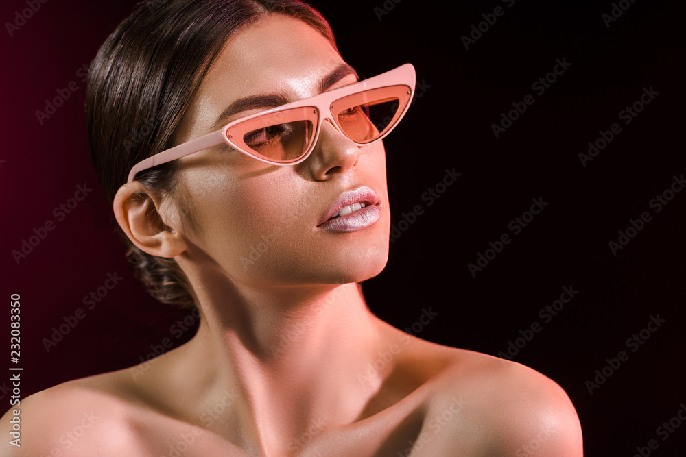 portrait of beautiful model in fashionable eyeglasses on dark background portrait of beautiful model in fashionable eyeglasses on dark background