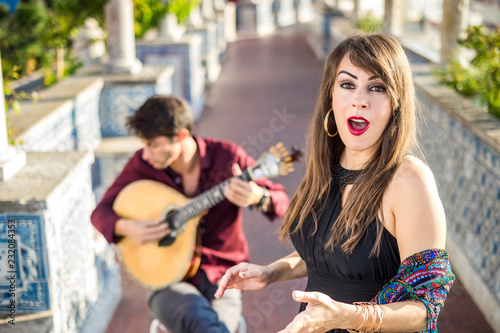 Band performing traditional music fado under pergola with azulejos in Lisbon, Portugal