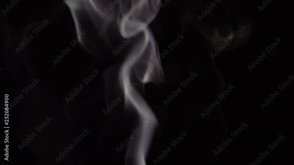 White Steam Rises from up. White smoke over a black background. Smoke slowly floating through space against black background. Slow Motion. White Steam Rises from up. White smoke over a black background. Smoke slowly floating through space against black background. Slow Motion.