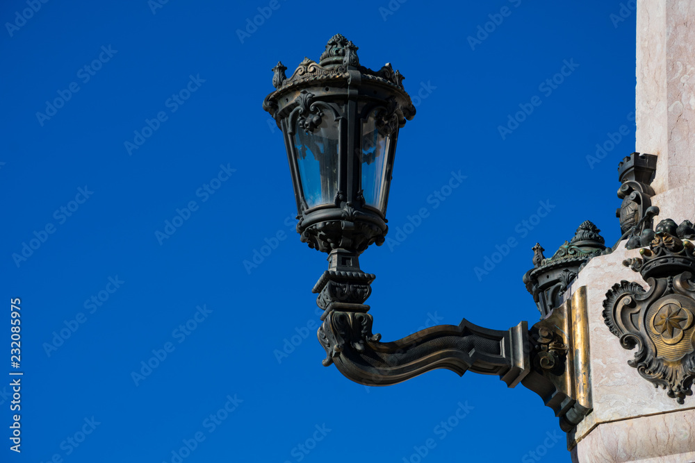 Old street lamp at The Marquess of Pombal Square (Praca do Marques de Pombal). Lisbon, Portugal