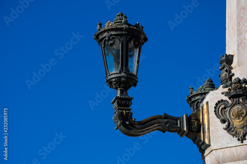 Old street lamp at The Marquess of Pombal Square (Praca do Marques de Pombal). Lisbon, Portugal