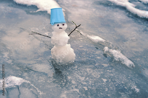 Slika na platnu melted snow and snowman in puddle, natural abstract background