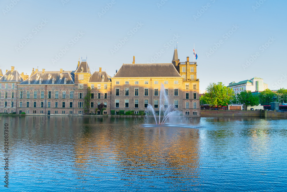 facade of Binnenhof - Dutch Parliament with reflections in pond, The Hague, Holland