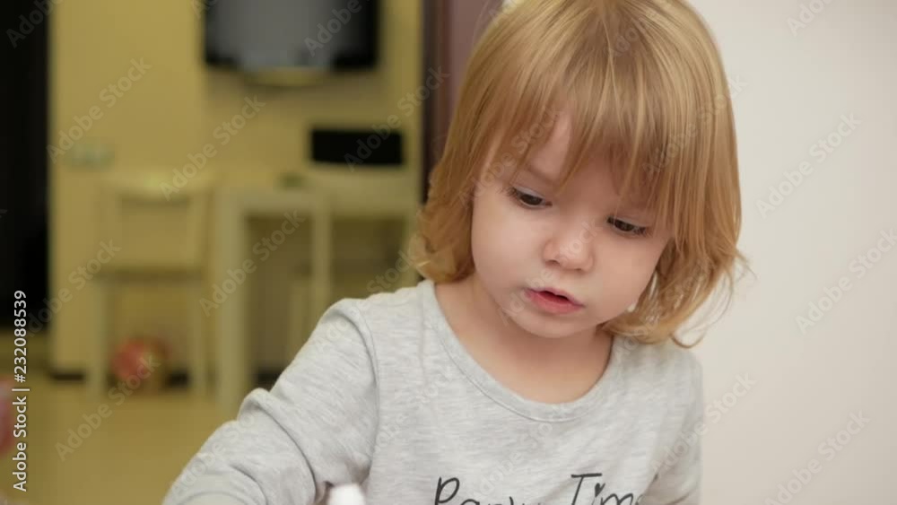 Girl draws a marker on paper Girl draws a marker on paper