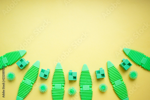various kids toys background in green colours  colorful assorted