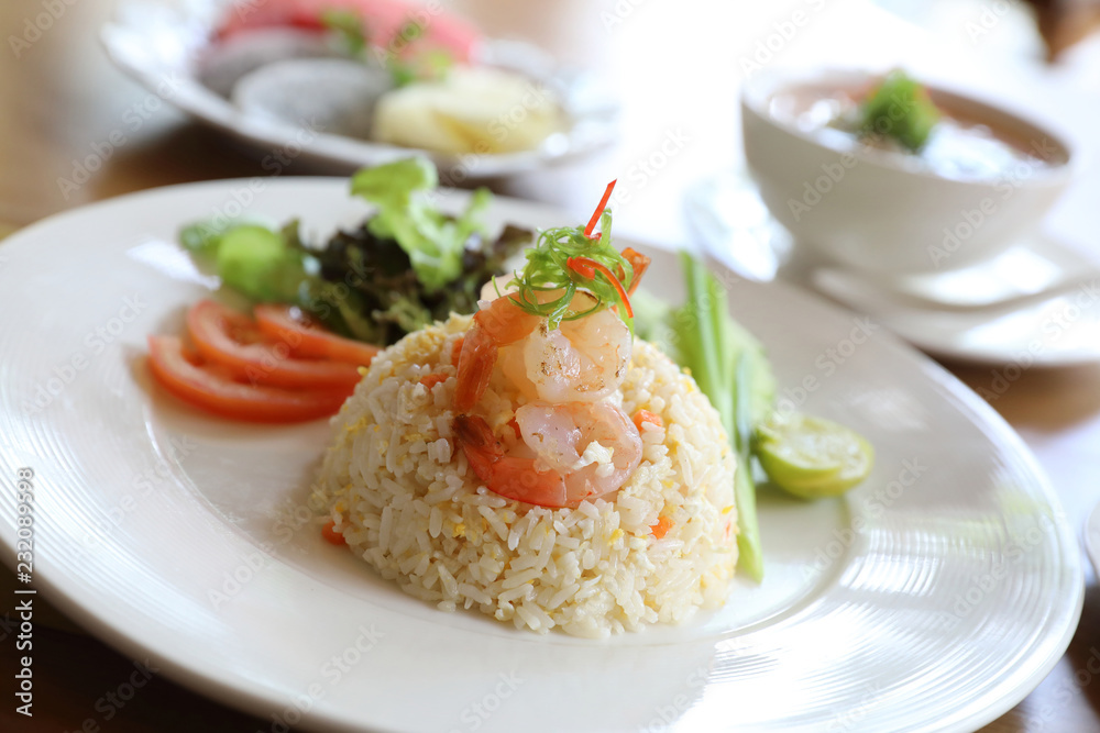 Fried rice with shrimp on wooden table Fried rice with shrimp on wooden table