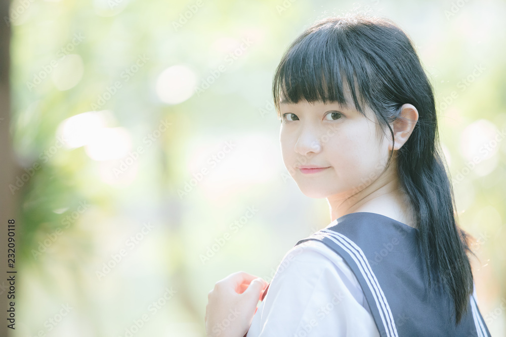 Portrait of asian japanese school girl costume looking at park outdoor film vintage style Portrait of asian japanese school girl costume looking at park outdoor film vintage style