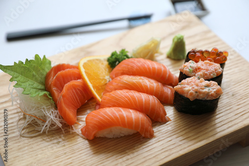 Salmon sushi and sashimi on wood plate Japanese food