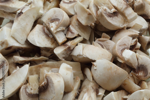 A close view of a bunch of sliced Agaricus bisporus, also known as champignon mushroom