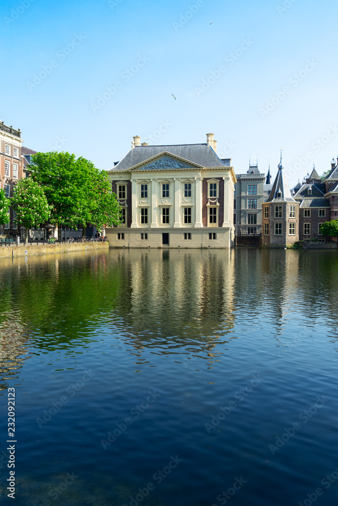 historical city center of Den Haag - Dutch pairlament Binnenhof, Mauritshuis and with reflections in pond, Netherlands