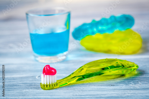 children s toothbrush oral care on wooden background