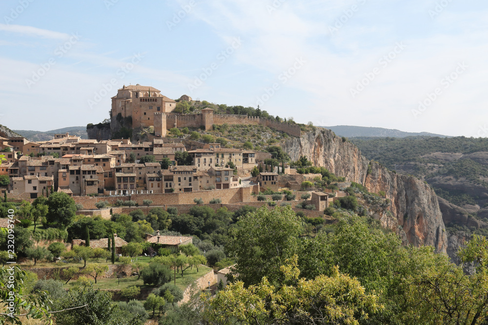 A landscape, during a sunny summer, of Alquezar, a small medieval rural town with a castle monastery and a canyon in the Vero river, in Aragon, Spain