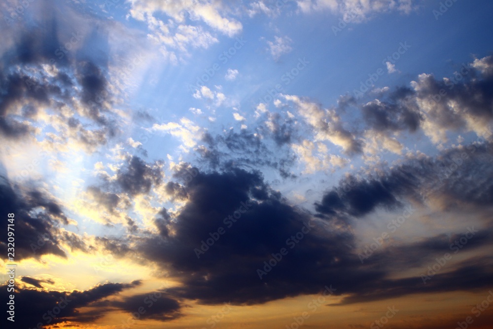 Obraz premium nice colorful with sun rays clouds in the sky for using in design as background.