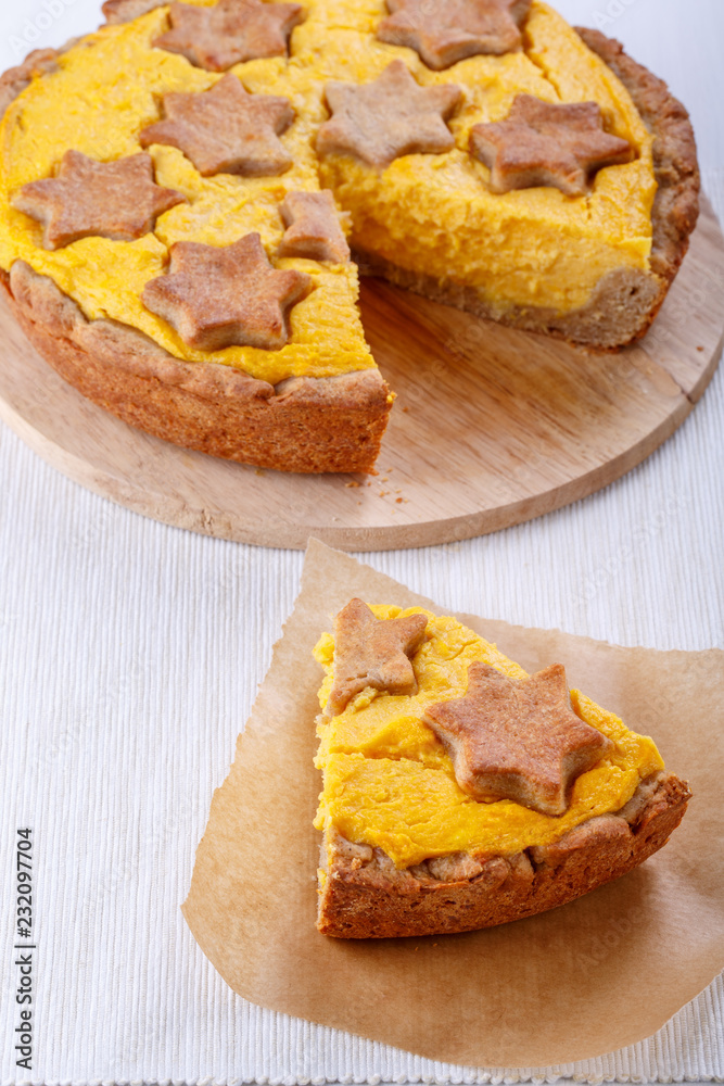 Traditional homemade pumpkin pie on white. Traditional homemade pumpkin pie on white.
