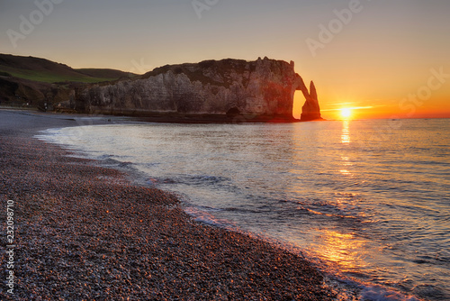 France, Normandy, Cote d'Albatre, rock coast of Etretat by sunset photo