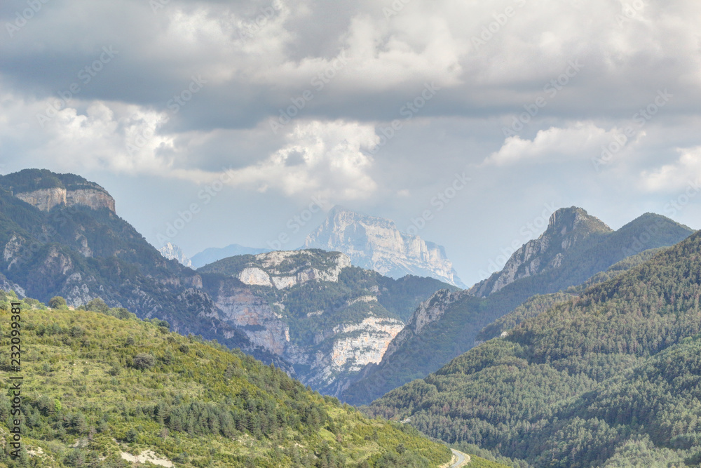 The Peña Montañesa range during a summer cloudy day in the Aragon Pyrenees mountains, Spain