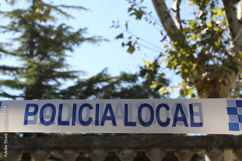 A Spanish police white and blue tape with the Local
