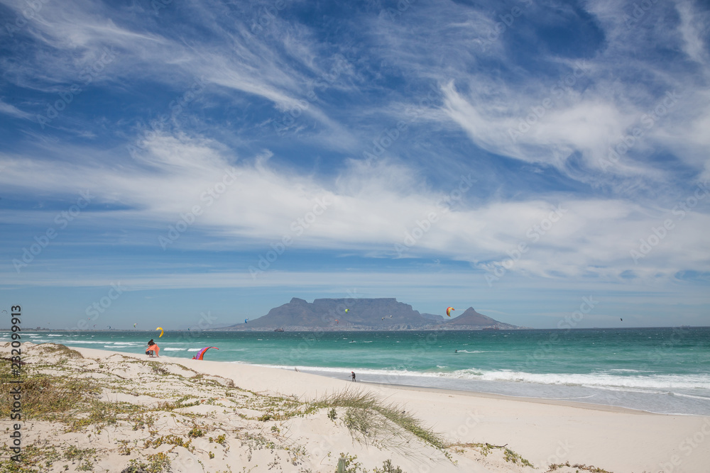 Wide shot of Table Mountain from Blouberg Beach on cloudy day